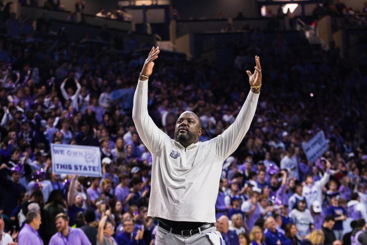 Assistant+coach+Jareem+Dowling+walks+around+the+court+during+a+timeout+to+encourage+fans+to+get+up+and+be+loud+as+K-State+battles+No.+4+Kansas.+The+Wildcats+took+the+Jayhawks+into+overtime%2C+resulting+in+a+win+of+75-70+on+Feb.+5+in+Bramlage+Coliseum.+
