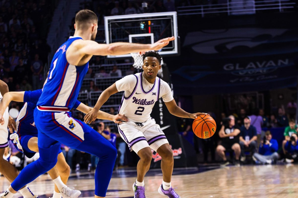 Guard Tylor Perry maneuvers through lane in the 75-70 overtime win against No. 4 Kansas. Perry lifted the Wildcats to the win, scoring 26 points with eight coming in overtime.