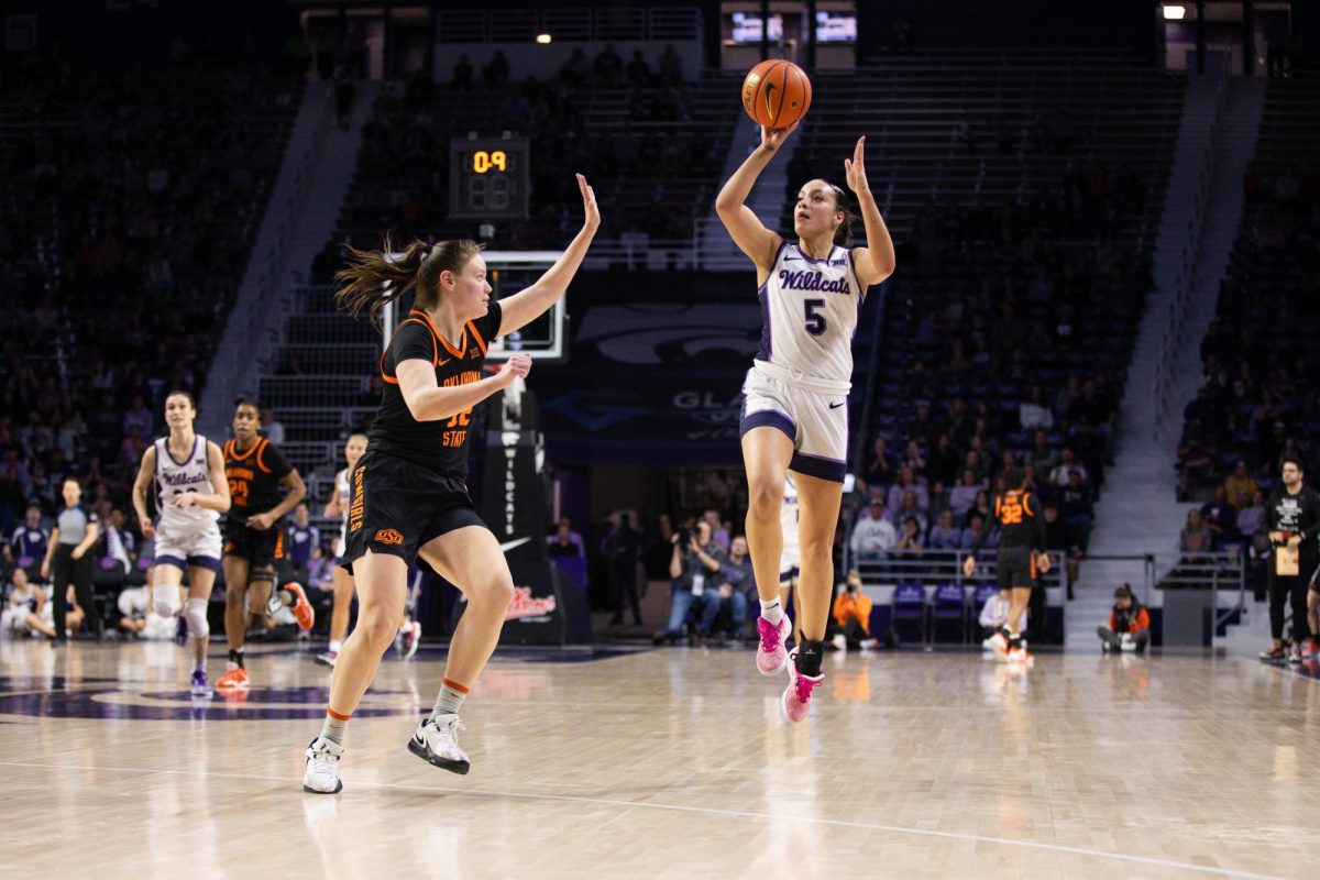 Guard Serena Sundell attempts to block a shot against Oklahoma State in K-States 69-68 victory. The Wildcats followed up the close win with a 96-93 double overtime loss to Iowa State.