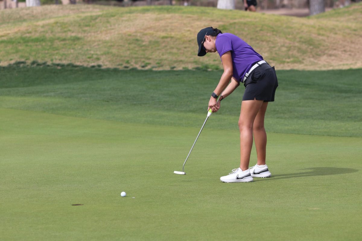 Senior golfer Haley Vargas attempts a put shot in the Westbrook Invitational. Vargas led the way with 7 under par for K-State as the team shot a school-record low 54-hole score of 24 under par. (Photo courtesy of K-State Athletics)