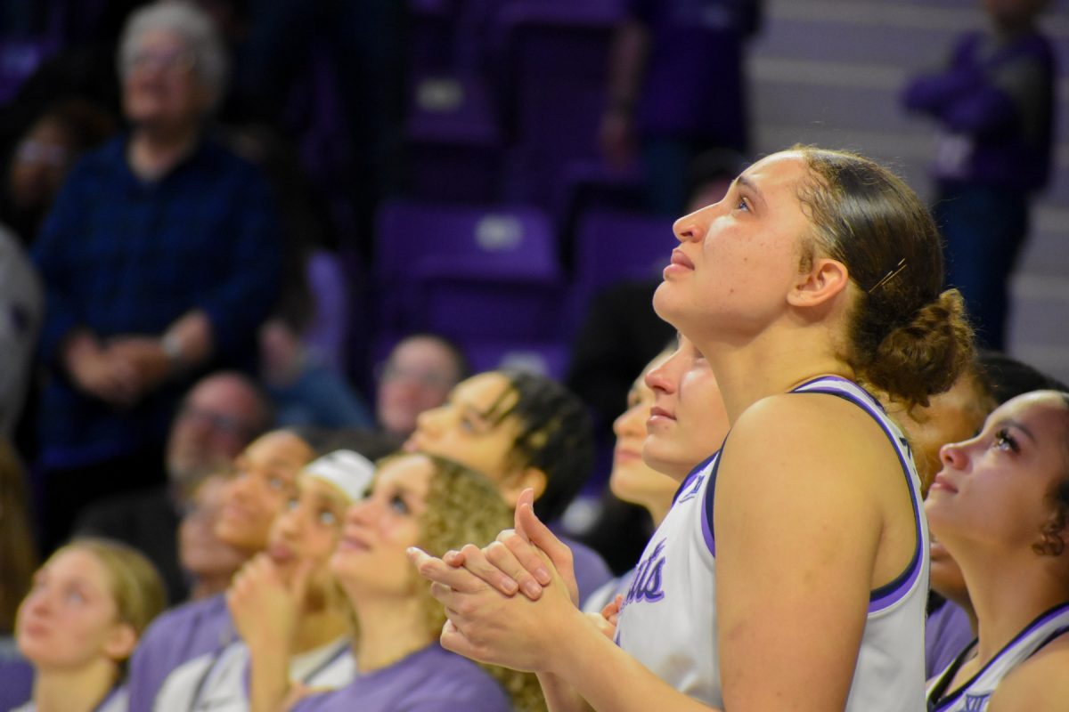 A teary-eyed Ayoka Lee looks up at the Bramlage Coliseum jumbotron during senior night. The center was honored for her K-State career alongside seniors guards Gabby Gregory and Rebekah Dallinger.