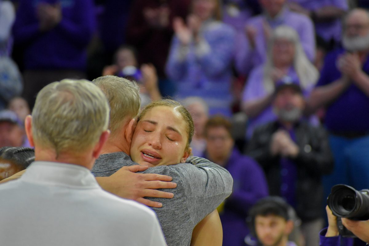 Center Ayoka Lee cries as she embraces head coach Jeff Mittie.