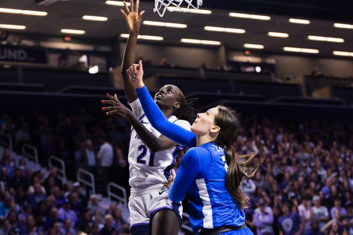 Forward Eliza Maupin jumps against the BYU defense to score. The Wildcats beat the Cougars on Jan. 27 67-65 at Bramlage Coliseum.