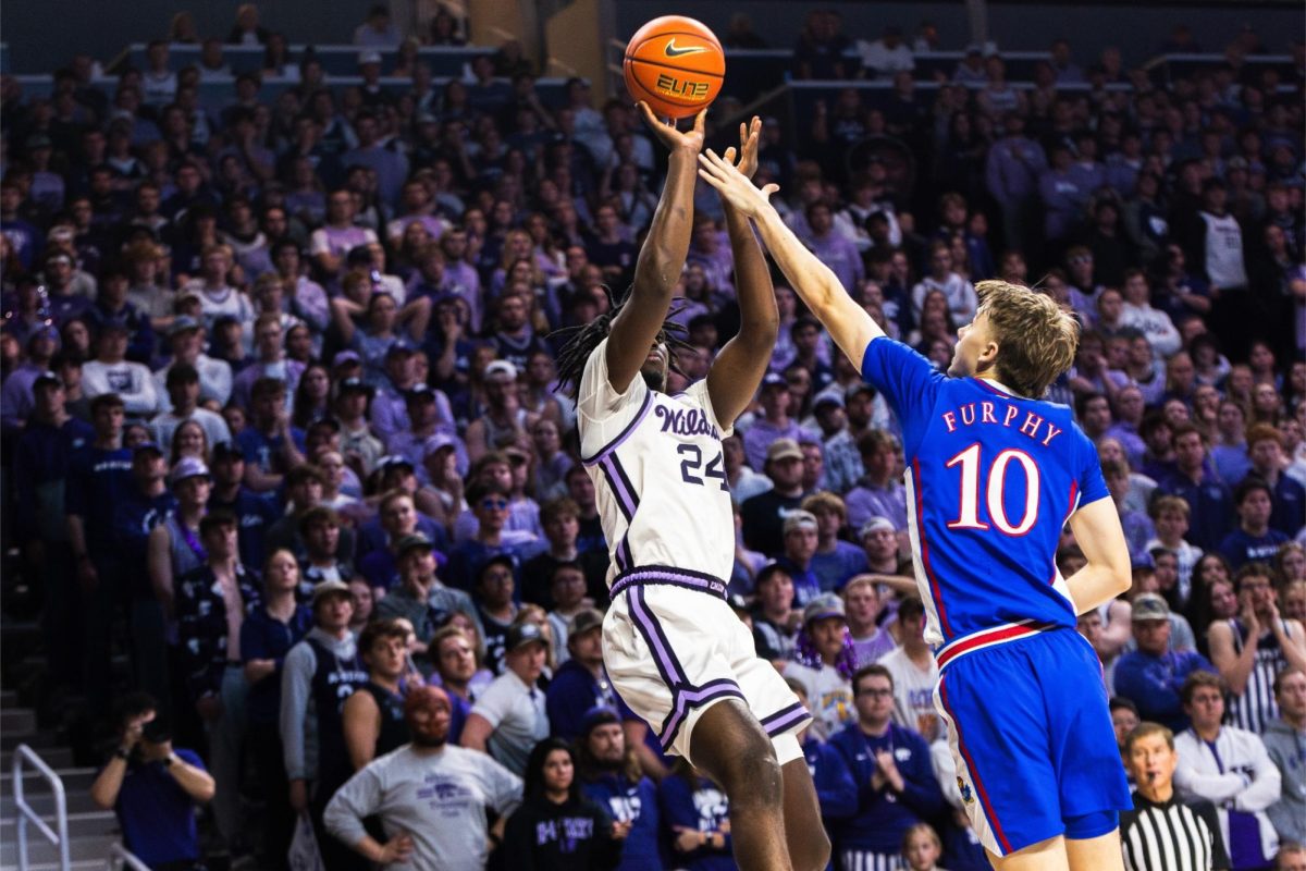 Guard Arthur Kaluma jumps to make a 3-pointer against No. 4 Kansas on Feb. 5. Against Texas on Feb. 19, Kaluma finished with 15 points and seven rebounds in the 62-56 loss.