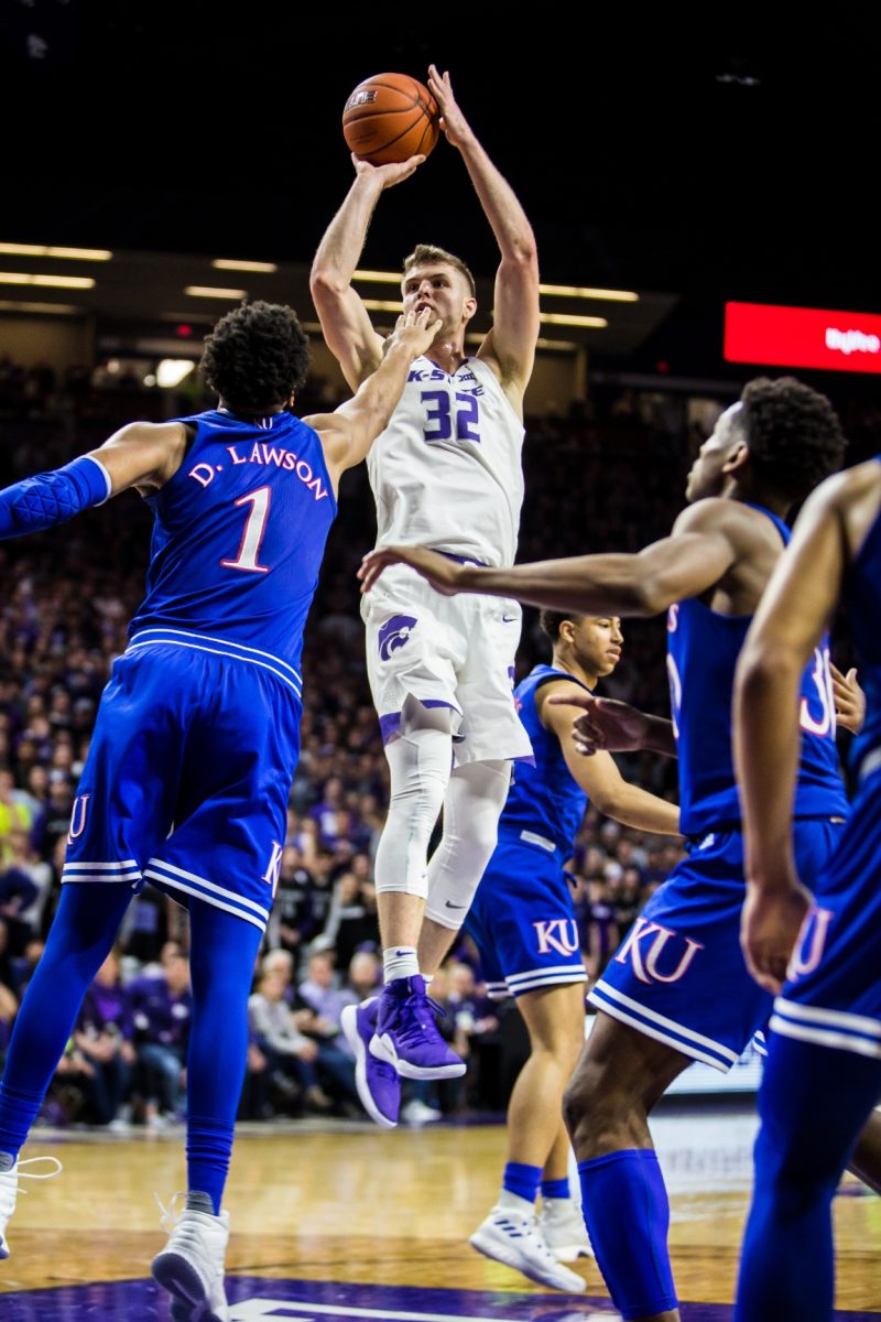Forward Dean Wade shoots a contested jumper in K-State’s 74-67 win over Kansas on Feb. 5, 2019. Wade scored 12 points and grabbed nine rebounds to break an eight-game losing streak in the Sunflower Showdown.