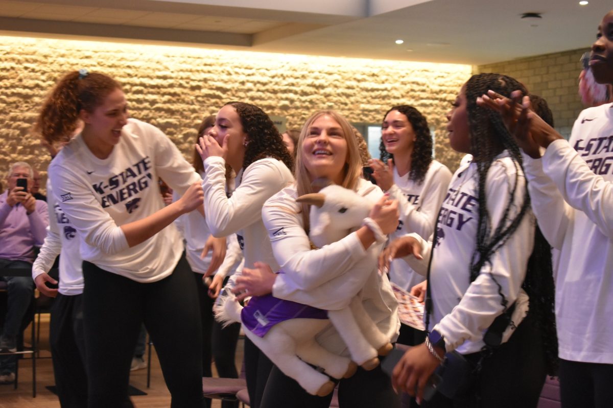 The+womens+basketball+team+celebrates+after+hearing+their+name+called+as+the+No.+4+seed+in+March+Madness.+This+allows+Manhattan+to+host+the+first+two+rounds+of+the+tournament+and+gives+K-State+home+court.