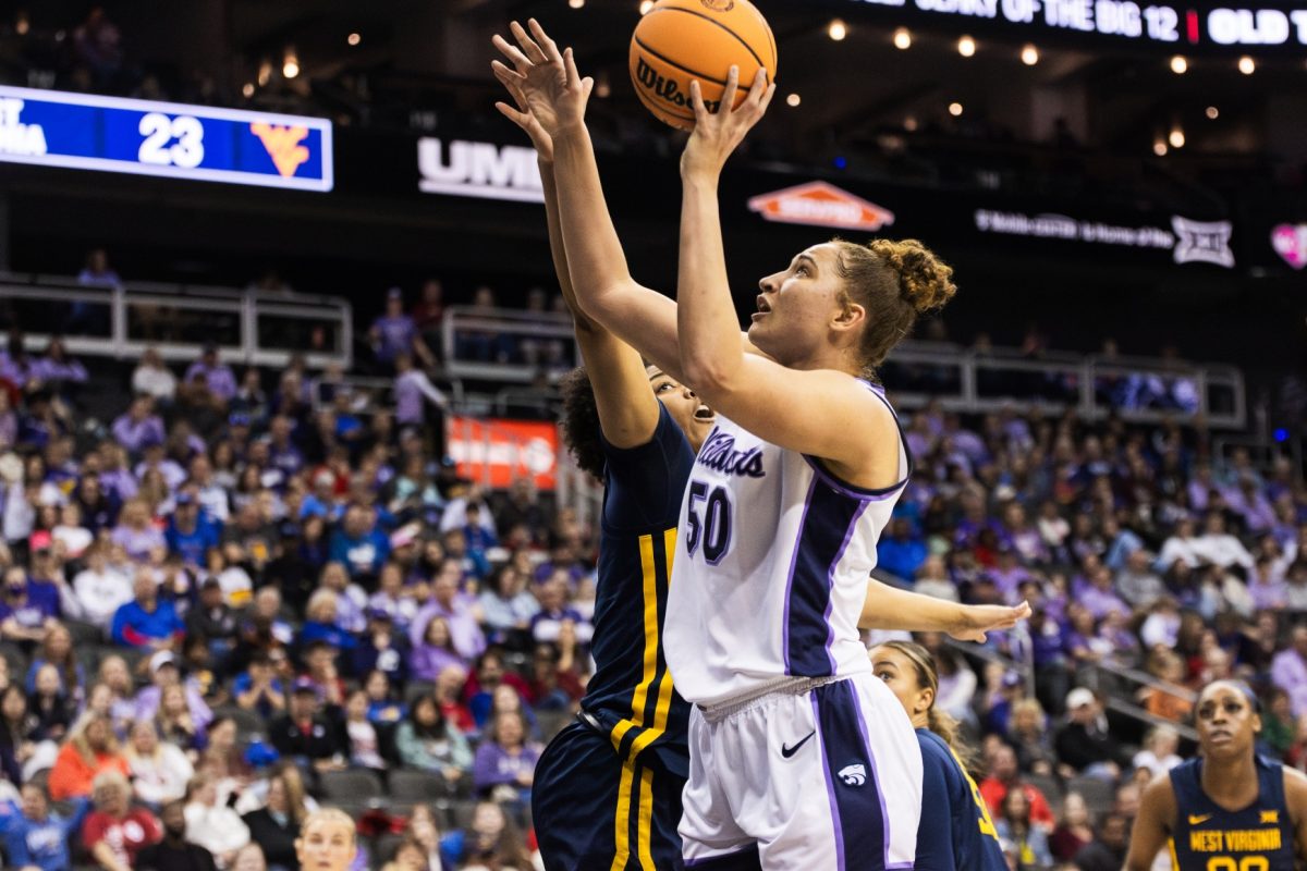 Center Ayoka Lee goes for a layup against West Virginia in the Big 12 tournament quarterfinals. In the 65-62 Wildcat victory, Lee grabbed a double-double with 22 points and 11 rebounds.