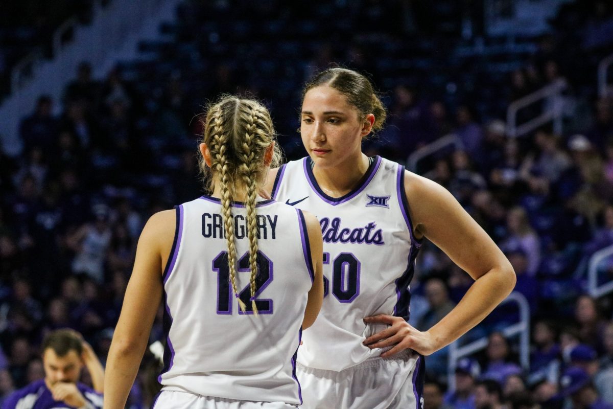 Seniors Ayoka Lee and Gabby Gregory huddle together during a stopped play. The women’s basketball team fell on senior night to Iowa State 82-76 Feb. 28.