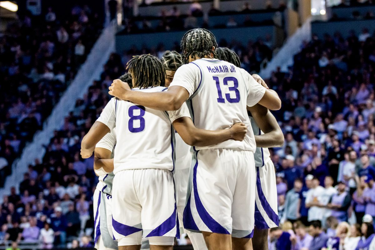 The men's basketball team gathers in a huddle against Iowa State on March 9 as the Wildcats defeated the Cyclones 65-58 at Bramlage Coliseum. The Wildcats keep postseason play alive in the NIT, starting against No. 3 seed Iowa.