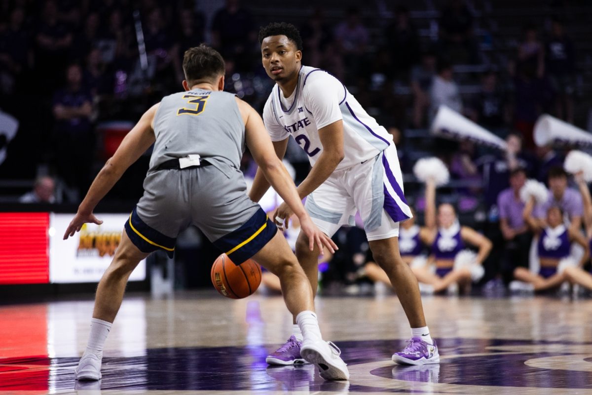 Tylor Perry dribbles the ball against West Virginia Feb. 26 in the Wildcats 94-90 overtime victory. Against Cincinnati on Saturday, Perry topped the scoring chart with 26 points in the Wildcats 74-72 loss.