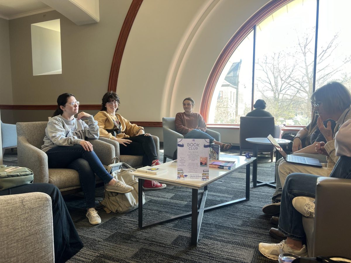 Seven+students+gather+to+discuss+the+book+Where+the+Crawdads+Sing+by+Delia+Owens+at+the+first+book+club+meeting+at+Hale+Library.+The+first+meeting+took+place+on+March+20.