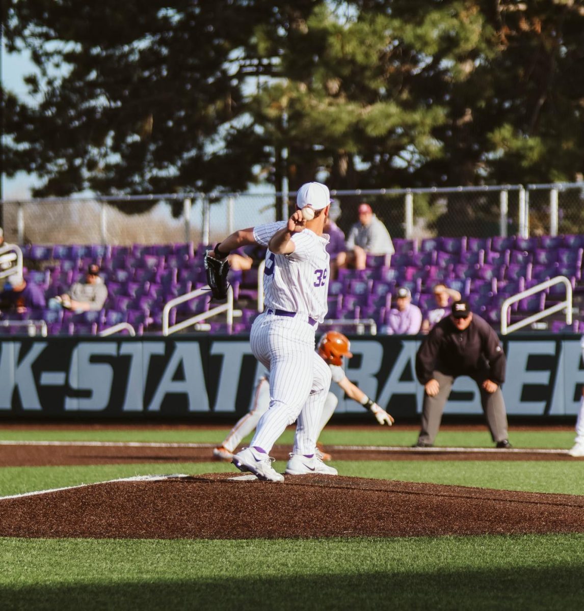 Starting pitcher Josh Wintroub tries to throw out a Texas runner in the 14-3 win over the Longhorns. Wintroub grabbed the win, pitching 5.1 innings and striking out five as his offense gave him 10 runs in five innings.