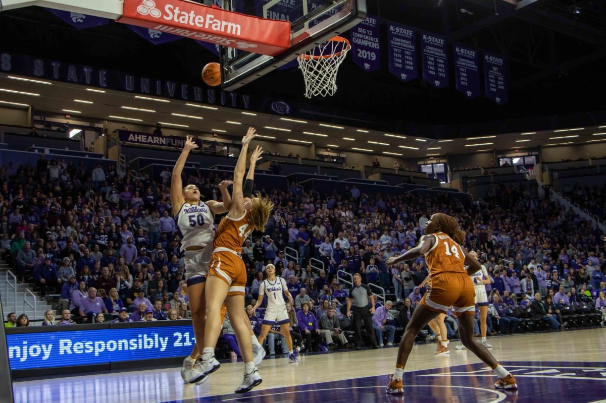 Center+Ayoka+Lee+throws+up+a+shot+against+Texas+forward+Taylor+Jones+in+the+teams+first+matchup+of+the+season.+In+Bramlage+Coliseum+on+Jan.+10%2C+the+No.+11+Wildcats+emerged+victorious+over+the+No.+10+Longhorns+61-58.