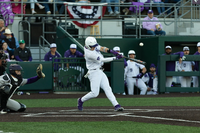 At bat, freshman outfielder Nick English hits the ball against Holy Cross on Feb. 24. In Game 3 against Cincinnati, English played designated hitter and hit the game-sealing single in the extra innings game.