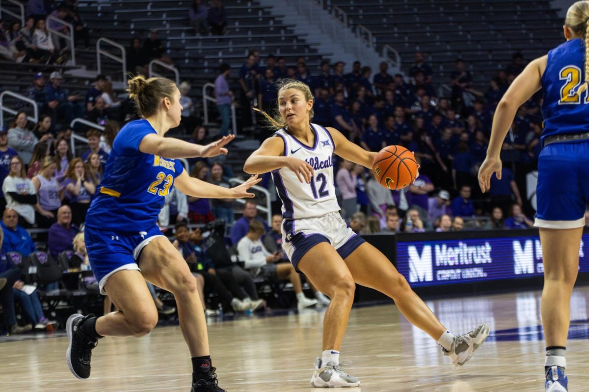 Guard Gabby Gregory moves the ball around the McNeese State defense. The Wildcats demolished the Cowgirls 101-39 at Bramlage Coliseum on Dec. 6, 2023.