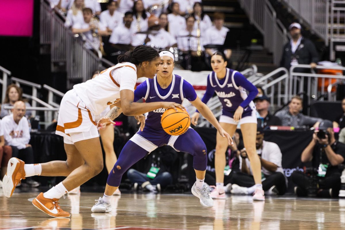 Guard Zyanna Walker covers Texas forward Madison Booker on defense. Walkers fourth quarter coverage of Booker allowed the Wildcats to close the gap, although ultimately fell 71-64.