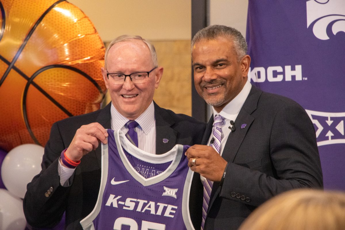 Athletic Director Gene Taylor poses with men's basketball head coach Jerome Tang at his introductory press conference on March 23, 2022. In Tang's two years after being hired by Taylor he has won coach on the year, received an extension and stayed at Kansas State after reported interest from Arkansas. (Archive photo by Benjamin Voller | Collegian Media Group)