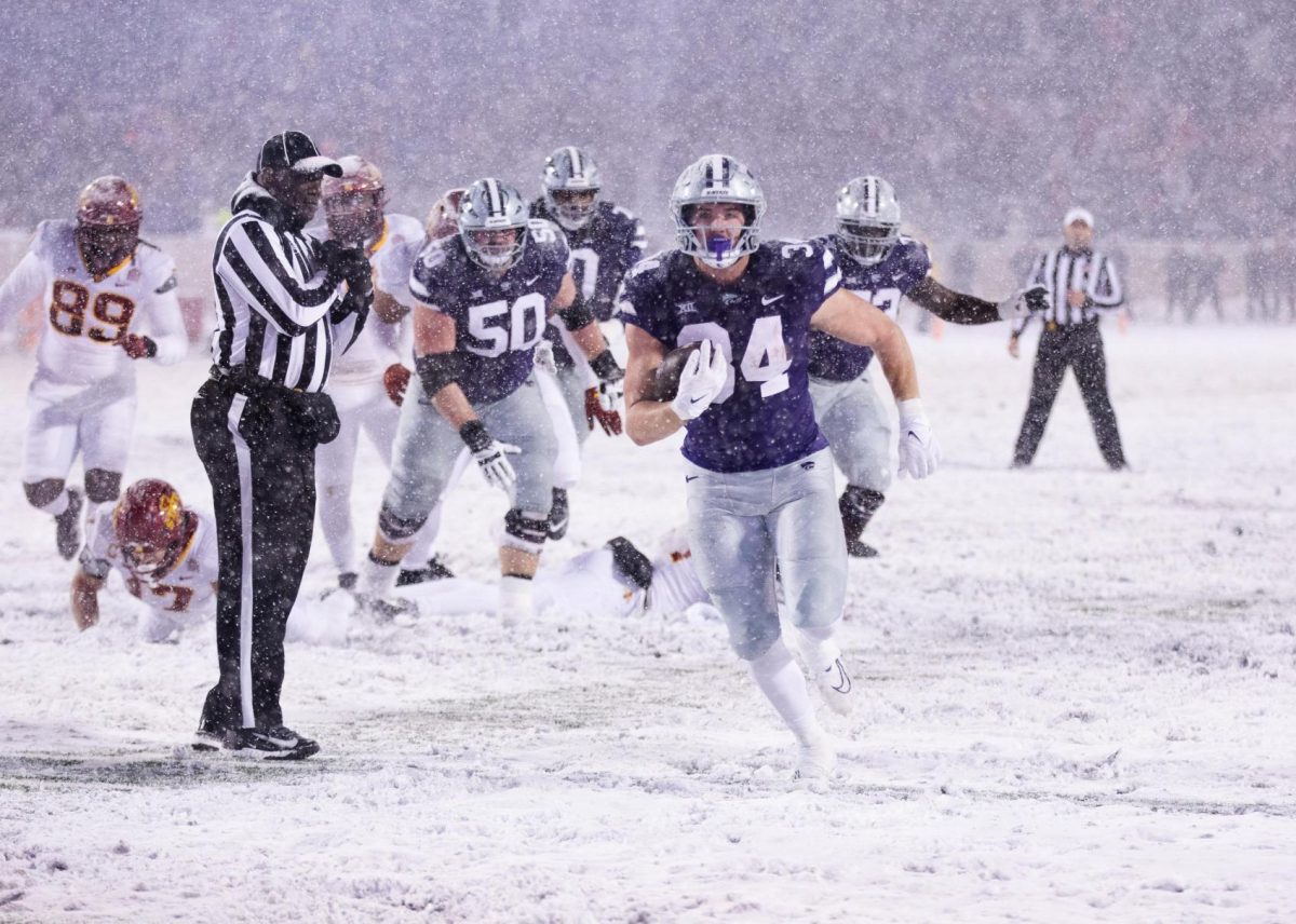 Ben Sinnott charges downfield after a block from Cooper Beebe on Nov. 25, 2023 in Bill Snyder Family Stadium. In the 2024 NFL Draft, Sinnott was drafted by the Washington Commanders at No. 53, followed by the Dallas Cowboys selecting Beebe at No. 73.