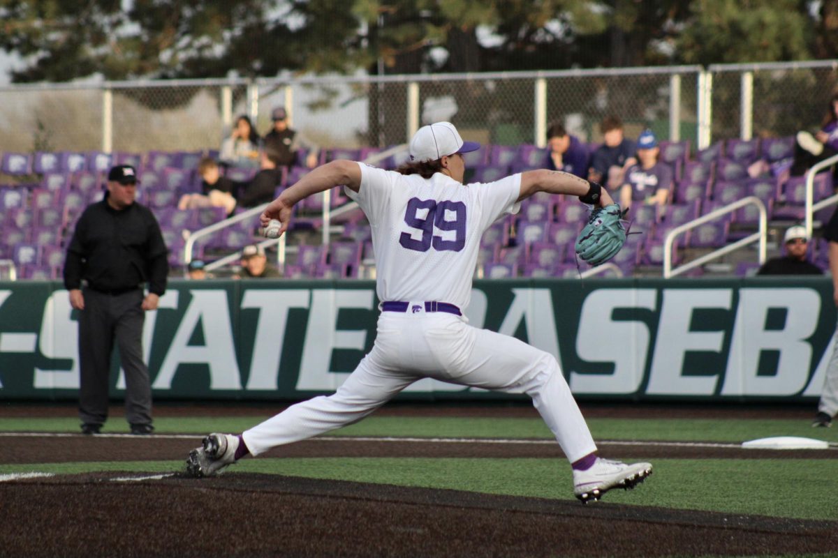 Pitcher JJ Slack draws his arm back for the pitch. Slack helped the Wildcats beat the Shockers in Manhattan 6-3 by pitching four scoreless innings.