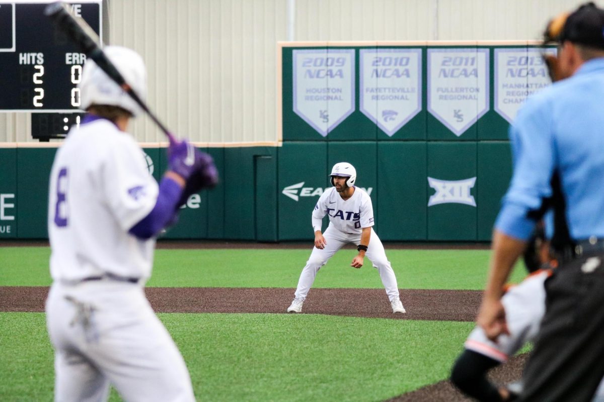 Infielder+Jaden+Parsons+leads+off+first+as+he+watches+the+ongoing+pitch.+Kansas+State+baseball+won+6-5+against+Oklahoma+State.+The+game+went+into+12+innings+at+Tointon+Family+Stadium.