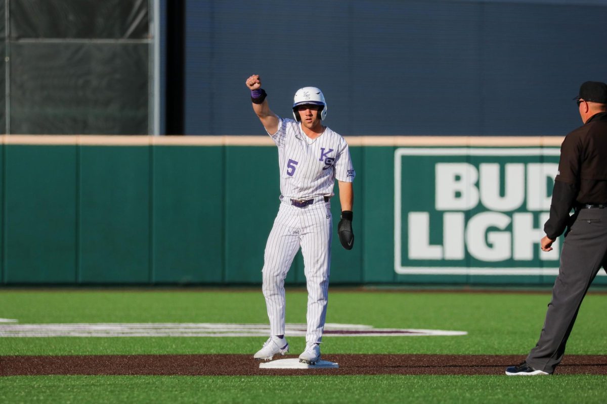 Junior Brendon Jones looks to the dugout after stealing second base. K-State won 6-4 against Omaha Tuesday at Tointon Family Stadium.