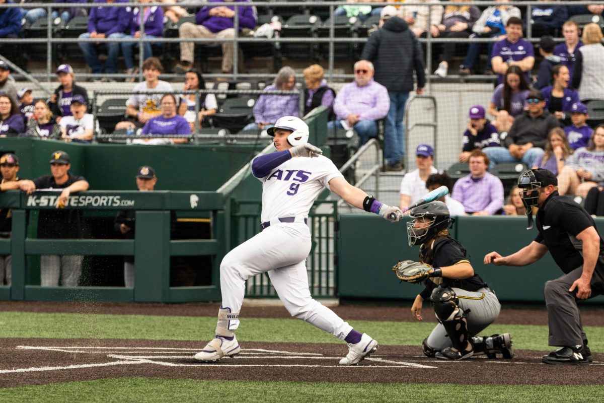 Outfielder Chuck Ingram looks at the ball after hitting it against his former team Wichita State. K-State won 6-3 as Ingram collected one hit in the Wildcats second win over Wichita State on the season. 