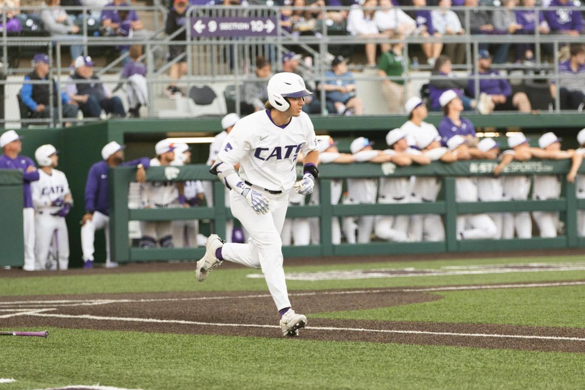 Second baseman Brady Day runs out of the batters box after a hit against Wichita State. Day went 3-4 on the night as K-State took down the Shockers 6-3.