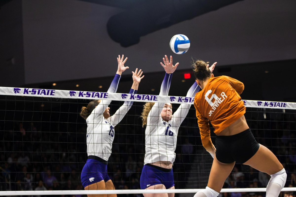 Setter Izzi Szulczewski and middle blocker Brenna Schmidt jump for a block in the upset sweep of Texas, the eventual NCAA champions. In February, The NCAA approved a rule allowing successive contacts for the 2024-25 season.