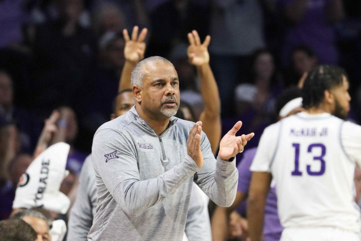 Head Coach Jerome Tang claps for his players after taking the lead. The Wildcats beat the West Virginia Mountaineers 94-90 Feb. 26 in Bramlage Coliseum.