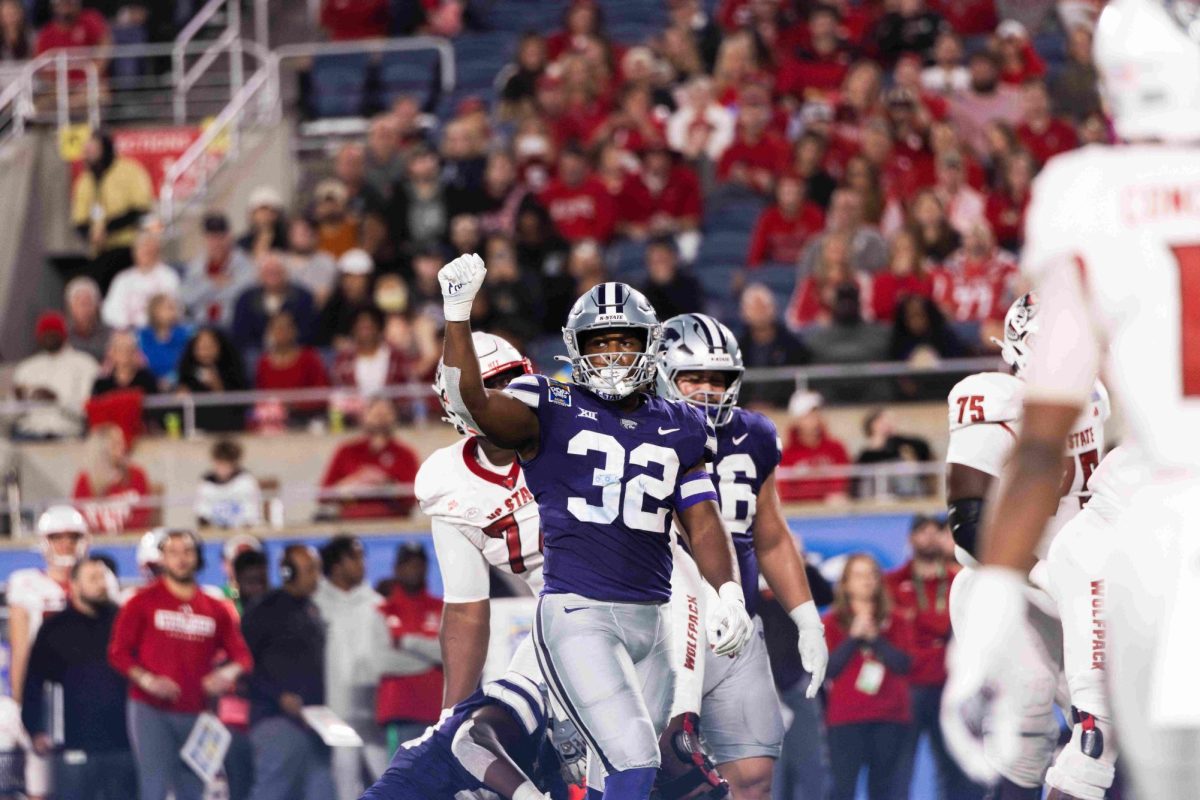 Then-sophomore linebacker Desmond Purnell holds his hand up after the K-State defense stopped NC State short of a first down. K-State won the Pop-Tarts Bowl Dec 28, 2023 with a defensive unit composed of many players returning for 2024. 