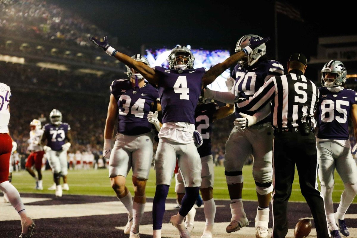 Arms out to the crowd, then-senior wide receiver Malik Knowles celebrates after scoring a touchdown on November 26, 2022. K-State beat the University of Kansas 47-27. 