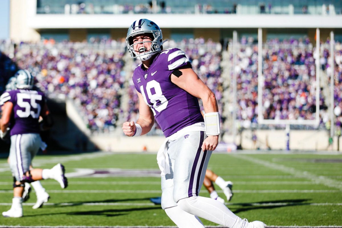 Then-junior quarterback Will Howard fist pumps during the Wildcats' 2022 win over Oklahoma State. K-State defeated the No. 9 Cowboys 48-0 and fans later carried Howard off the field.