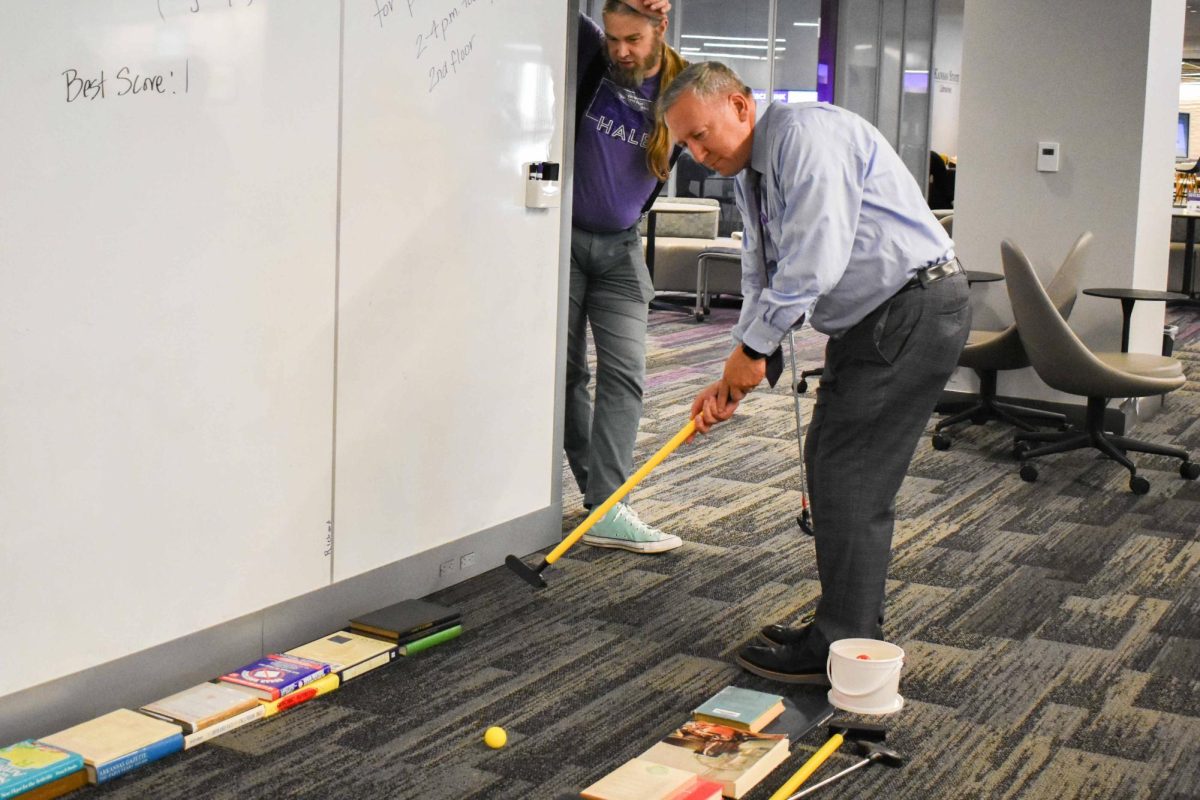 Hale Library hosted Purple Pride Putt Putt on Aug. 20. K-State President
Richard Linton made an appearance at the event and took a few swings
on the mini golf course.