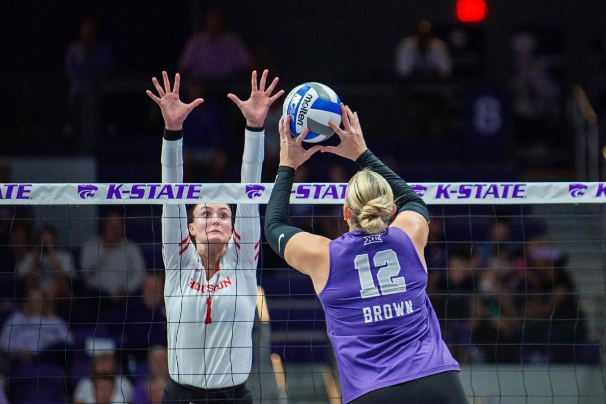 Middle blocker Meg Brown attacks at the net in K-State's matchup with Houston on Wednesday, Sept. 25, 2024. K-State lost the conference opener. 