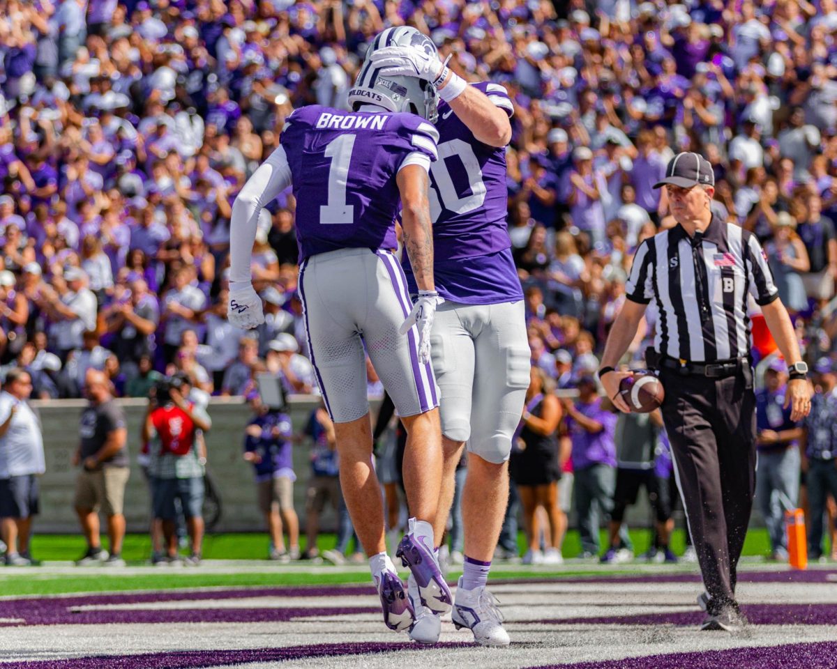 K-State wide receiver Jayce Brown celebrates a touchdown against Oklahoma State. The sophomore has become the Wildcats' leading receiver through his connection with his roommate quarterback Avery Johnson. 