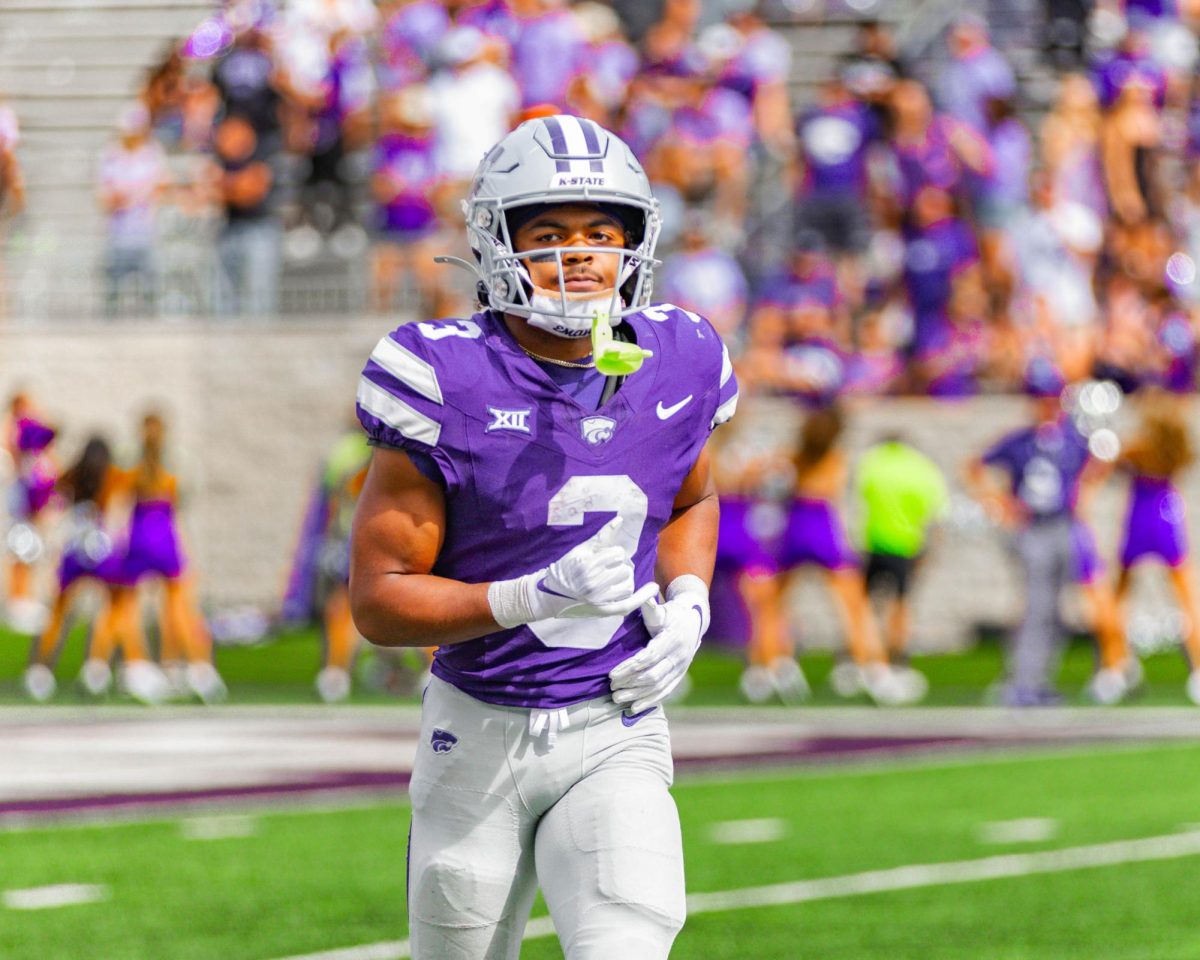 Sophomore running back Dylan Edwards looks on during K-State's gameday against Oklahoma State. The Wildcats defeated OSU 42-20 on Sept. 28 at Bill Snyder Family Stadium.