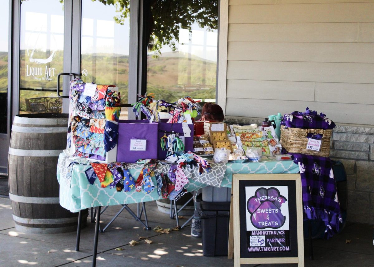 Theresa's Sweets & Treats has a booth full of colorful bandanas and yummy treats for the puppies to enjoy. This was held at the Liquid Art & Winery, celebrating a Puppy Paw-ty. 