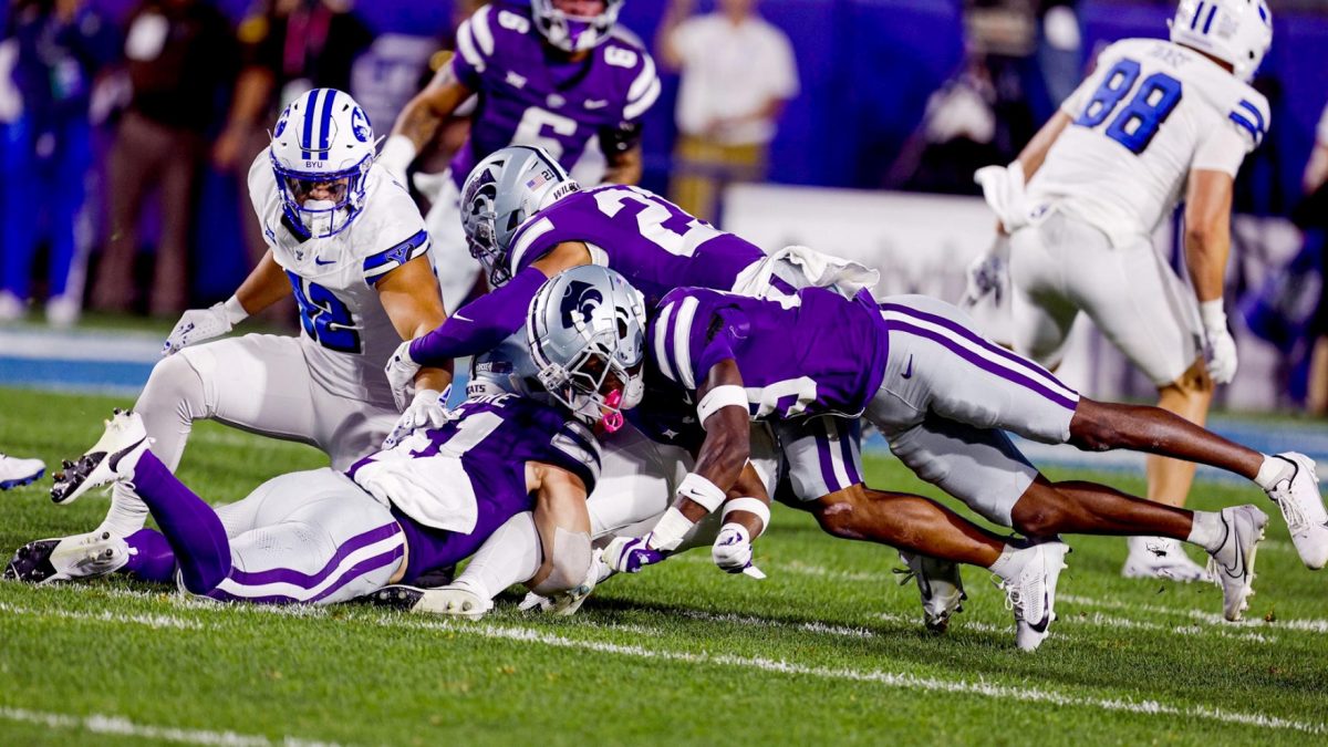 K-State tacklers flock to a BYU ball carrier in the two teams' first matchup as conference foes. BYU defeated K-State 38-9 in Provo. (Photo courtesy of K-State Athletics)