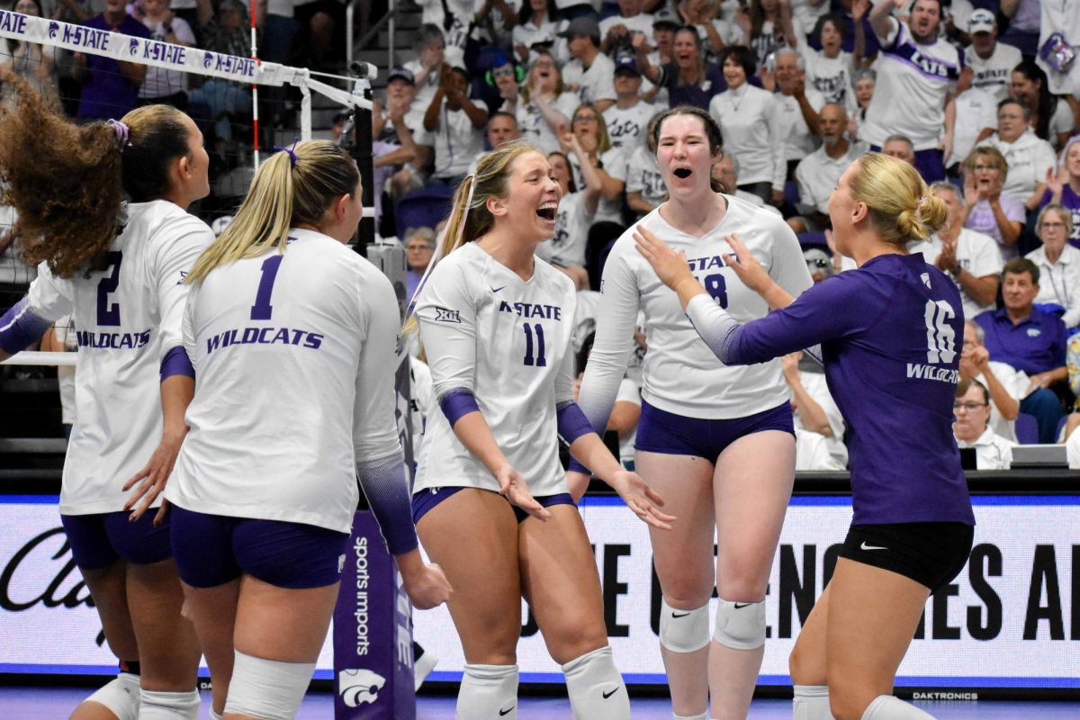 K-State celebrates after a point during its match with Iowa State on Saturday, Oct. 5. The Wildcats completed a reverse sweep of the Cyclones.