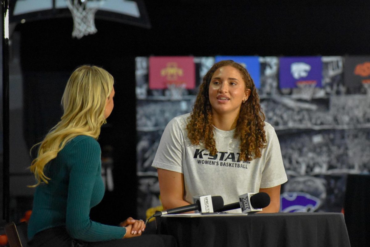 Seventh-year center Ayoka Lee speaks with an ESPN reporter during Big 12 Media Days on Oct. 22 at the T-Mobile Center in Kansas City, Mo. Lee was selected as the Big 12’s preseason player of the year.