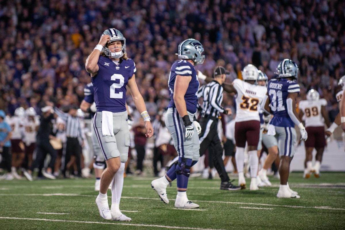 Sophomore quarterback Avery Johnson scratches his head after an interception against Arizona State on Nov. 16. No. 16 K-State lost 24-14 at Bill Snyder Family Stadium.