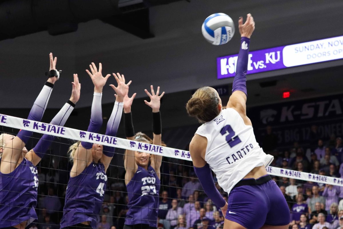 Outside hitter Aliyah Carter goes for a kill against No. 18 TCU on Nov. 15. Carter led the Wildcats in kills en route to a ranked upset sweep. 