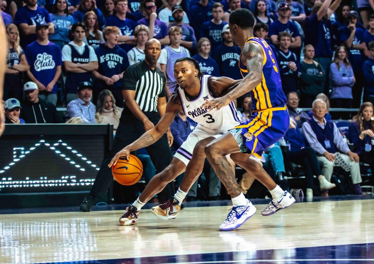 K-State guard CJ Jones is defended by former Wildcat guard Cam Carter playing for LSU. The senior led scorers with 20 points in his return to Manhattan. 