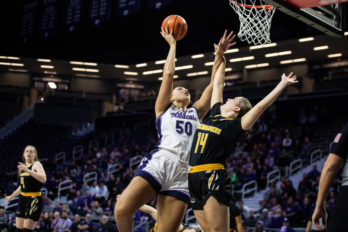 Center Ayoka Lee battles contact for a bucket as No. 10 K-State defeated Milwaukee 111-46 in Bramlage Coliseum on Nov. 20. 

