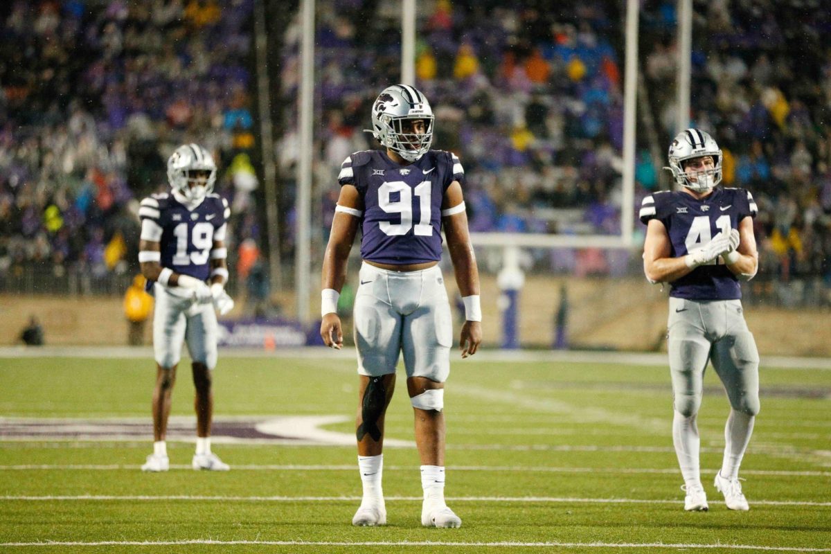 Defensive end Felix Anudike-Uzomah reads the offensive front during the game on Nov. 26, 2022. K-State beat Kansas 47-27. 