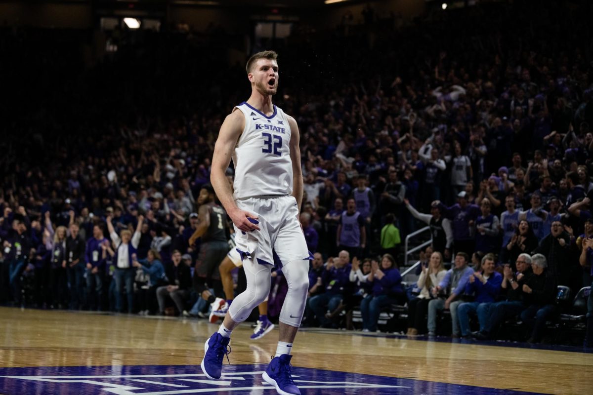 K-State senior forward Dean Wade roars in celebration after dunking the ball. The Wildcats played against the University of Oklahoma Sooners at Bramlage Coliseum, winning the Title with a final score of 68-53. 