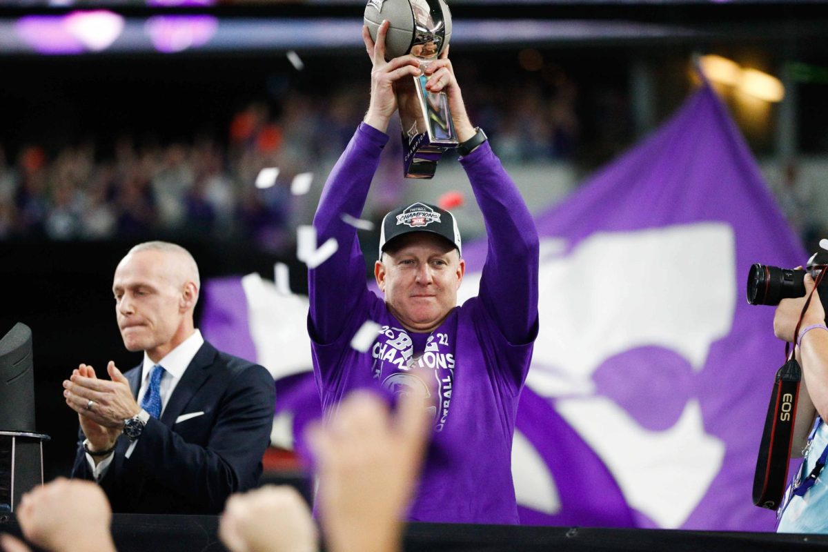 Head coach Chris Klieman hoists the Big 12 Champion trophy after defeating TCU in overtime 31-28 on Dec. 3, 2023. K-State’s trip back to Arlington in 2024 took a hit after losing to Houston.