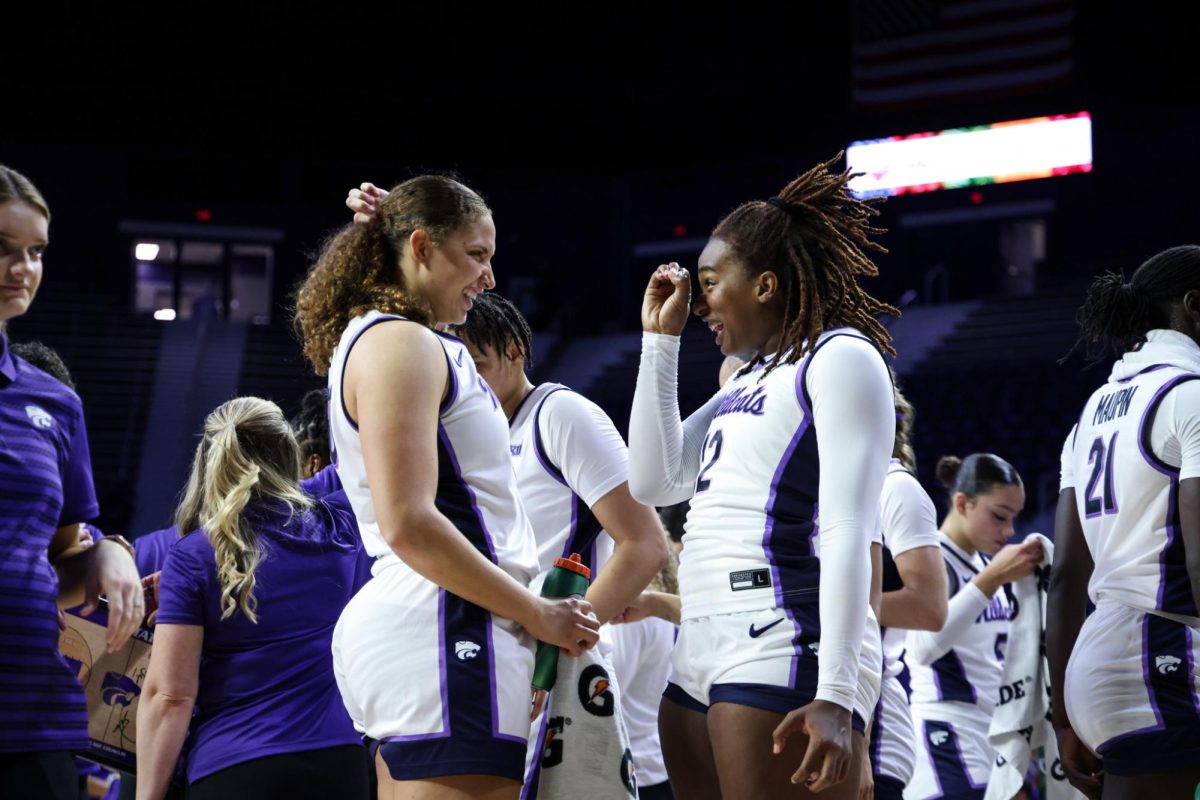 K-State centers Ayoka Lee (left) and Kennedy Taylor (right) have a laugh during No. 13 K-State's exhibition win over Washburn Rural on Oct. 30. A transfer from Missouri State, Taylor became the third Wildcat to record a double-double in a K-State debut against Green Bay in the season opener on Nov. 4. 