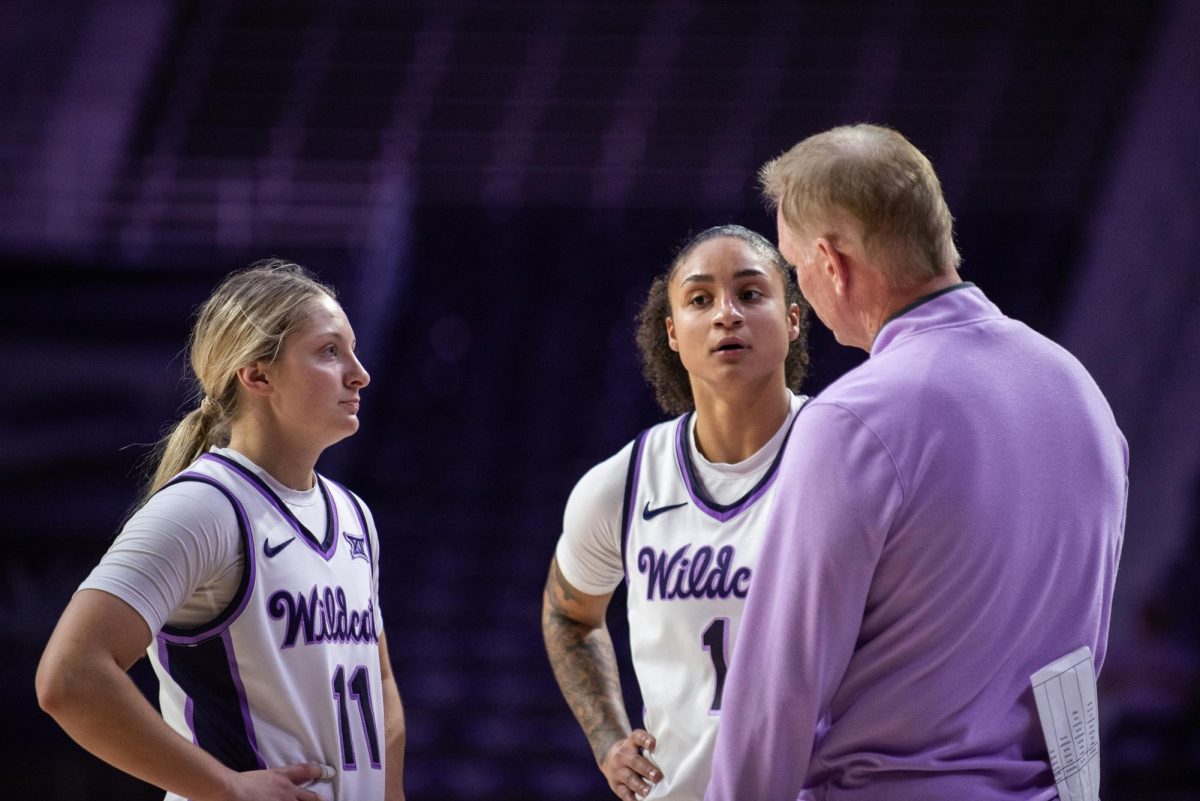 Guards Taryn Sides (11) and Zyanna Walker (1) talk with head coach Jeff Mittie during free throws. Walker and Sides combined for 24 points in the 111-46 win over Milwaukee.