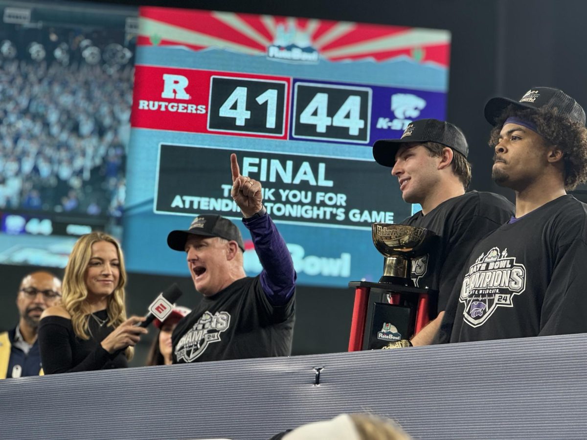 K-State head coach Chris Klieman (left) addresses the crowd following K-State's 44-41 Rate Bowl win in Phoenix, Arizona. Sophomore Dylan Edwards (right) was named offensive MVP while 
senior Austin Moore was named defensive MVP. 